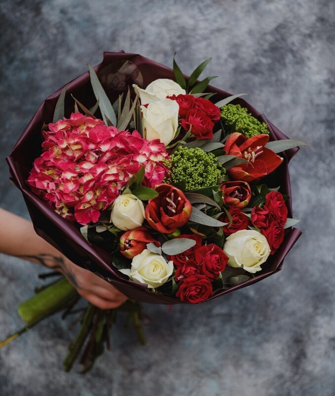 top view bouquet with white color roses red tulips pink hydrangea greenery