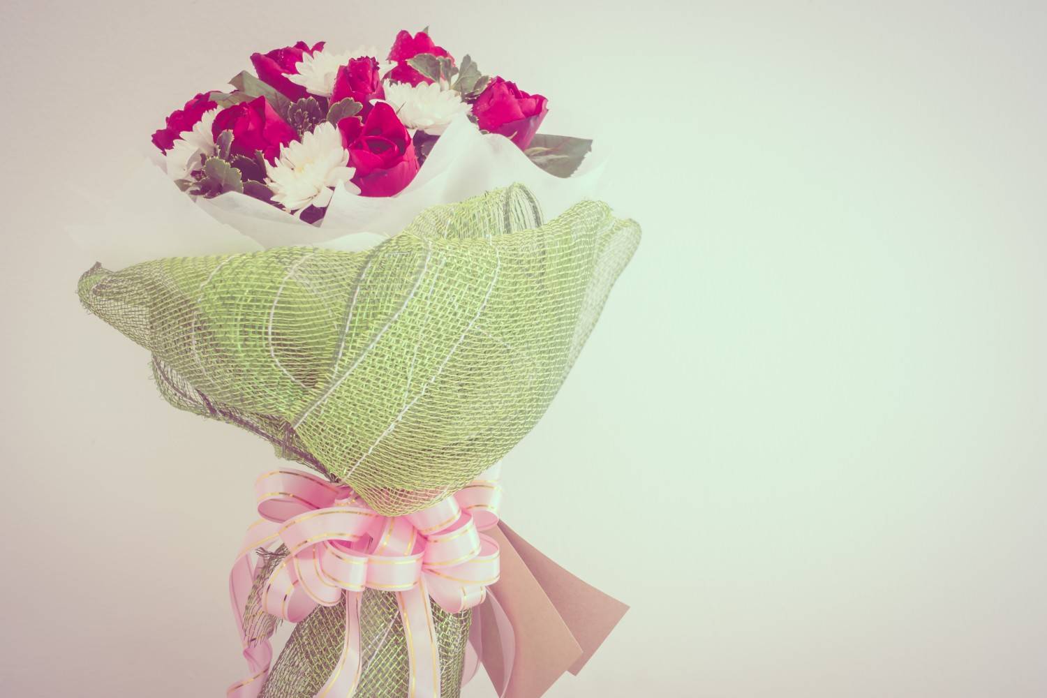 Elegant wrapped bouquet flowers with pink roses and decorative wrapping, designed for stylish floral gifting and special occasions.