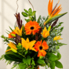 Bright tropical flower arrangement on stone countertop 1.png
